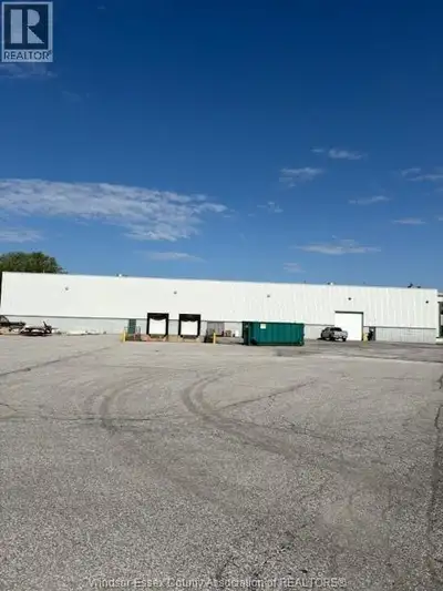 Clean high bay warehouse space available with both depressed docks and grade level door Space is app...