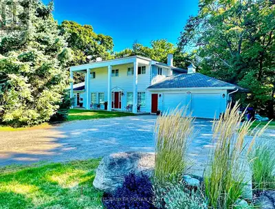 *GREAT INCOME POTENTIAL WITH MAIN LEVEL ACCESS IN-LAW SUITE*Luxury Living Meets Nature's Tranquility...