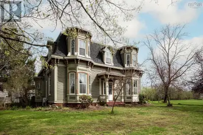 Storybook Second Empire Victorian on 8 acres in the heart of Paradise, Nova Scotia, this rare proper...