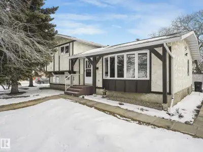 Great family home boasting 4 bedrooms, 2.5 baths, cathedral ceiling, woodburning fireplace & a 24x26...