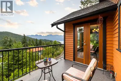 Charming mountainside home featuring breathtaking coastal mountain & ocean views. Set upon a private...