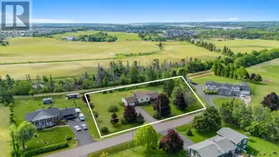 NEW PRICE! A rare opportunity to own an estate-sized lot and wonderful home offering privacy and dev...