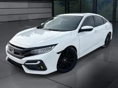 The 2020 Honda Civic Si Sedan in white offers a dynamic driving experience with its FWD drivetrain a...