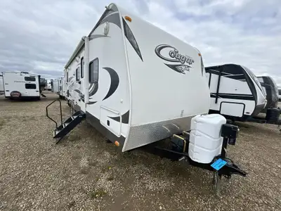 Family-Friendly Fun on the Road Keystone Cougar X-Lite 31SQB Travel TrailerExperience the ultimate f...