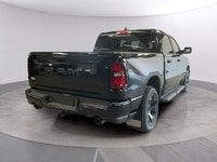 The 2026 Ram 1500 Express 4x4 Crew Cab 57 Box is a powerful yet stylish black truck thats ready for... (image 4)