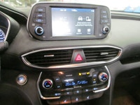 Finished in red with a black interior, this used 2019 Hyundai Santa Fe Preferred delivers the space,... (image 5)