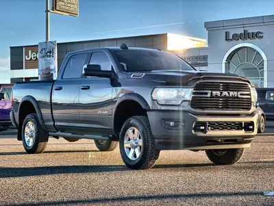 This 2019 RAM 3500 Crew Cab 4x4 Big Horn 149 WB 6.4 Box has the I6 6.7L Cummins Diesel engine with a...