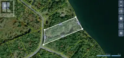 Waterfront lot on the Bras d'or Lake with a driveway already in place, power at the street and a nic...