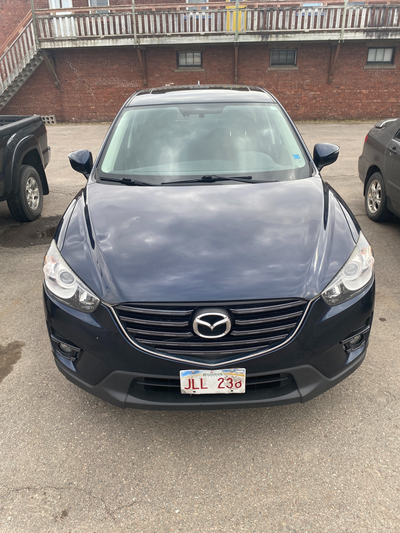 The 2016 Mazda CX-5 Touring is a top-tier choice for a compact SUV, blending sporty handling with pr...