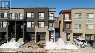 Experience refined living in this luxurious end-unit townhouse offering approximately 1,998 sq. ft....