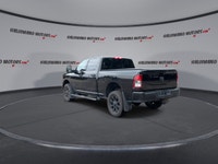 Meet the 2023 RAM 2500 Big Horn 4x4 Crew Cab 6'4 Box with the Night Edition package, offered by Hald... (image 5)