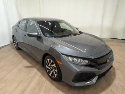 Locally Owned Vehicle!The 2018 Honda Civic Hatchback LX, draped in a sophisticated silver, is engine...