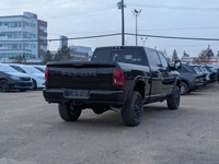 The 2026 Ram 2500 Limited Mega Cab Night Edition in Diamond Black Crystal Pearl delivers bold stylin... (image 6)