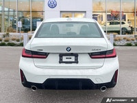 This 2025 BMW 3 Series 330i xDrive, stunning in White, unites its robust turbocharged engine with ag... (image 3)