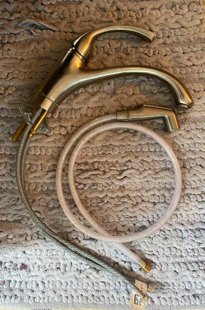 This is a Brushed Nickel Kohler Forte Faucet Used but in working condition. Side Sprayer needs to be...