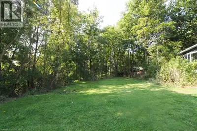 This rare ¼+ acre lot sits on a quiet street, in an established neighbourhood, in a welcoming small-...