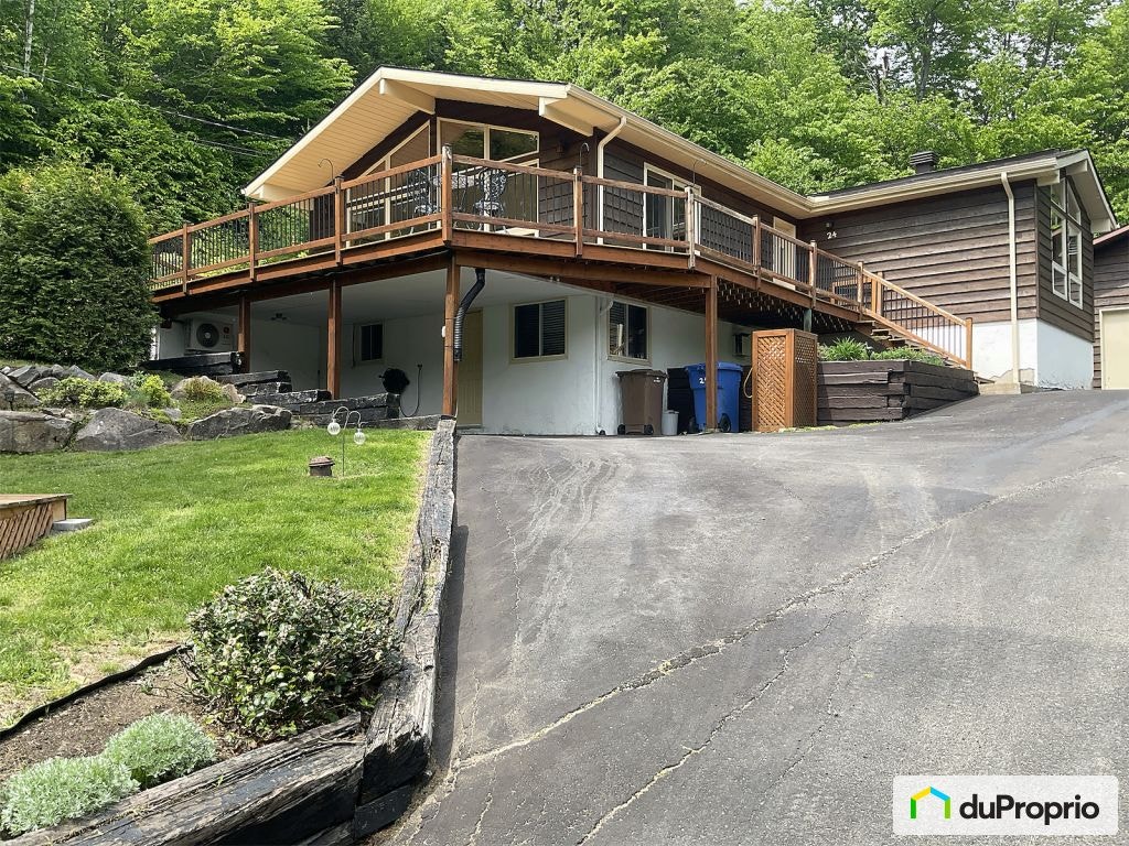 $485,000 - Raised Bungalow in Ste-Marguerite-Du-Lac-Masson — photo 1