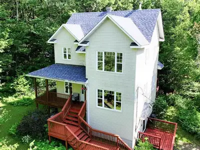 This stunning Victorian home sits on a private one-acre lot in peaceful Wakefield. The three-story h...
