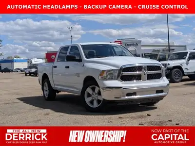 This pre-owned 2023 Ram 1500 Classic SLT Crew Cab is finished in Bright White with a clean Black and...