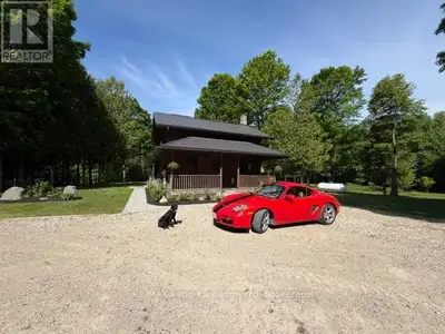 Nestled on over 34 acres of pristine natural beauty, this property offers a rare blend of privacy an...