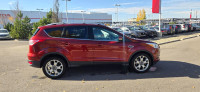Our 2015 Ford Escape Titanium in Sunset Orange is in stock and ready for your driveway! Call to book... (image 5)