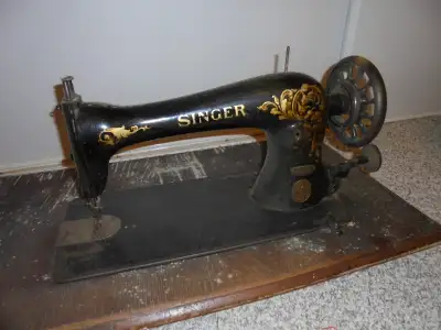Singer sewing machine dated to about 1913, including table surface.