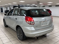 Silver light glances off the Titanium Metallic paint as it moves, the compact hatchback shape cuttin... (image 3)