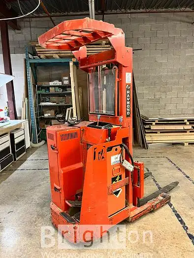 Raymond Model 810 Used Electric Reach Forklift with charger. See our website for more details. REF#...