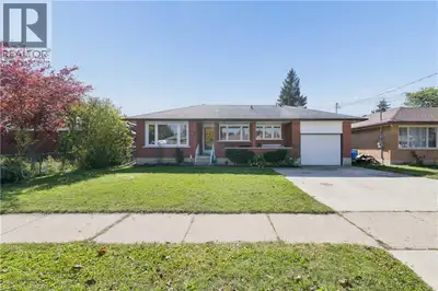 Welcome to 61 Fairlawn Rd, a brick bungalow with a covered front porch, an attached garage and much...