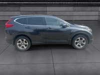 The 2018 Honda CR-V EX-L AWD in striking gray is the perfect blend of versatility and style, designe... (image 9)