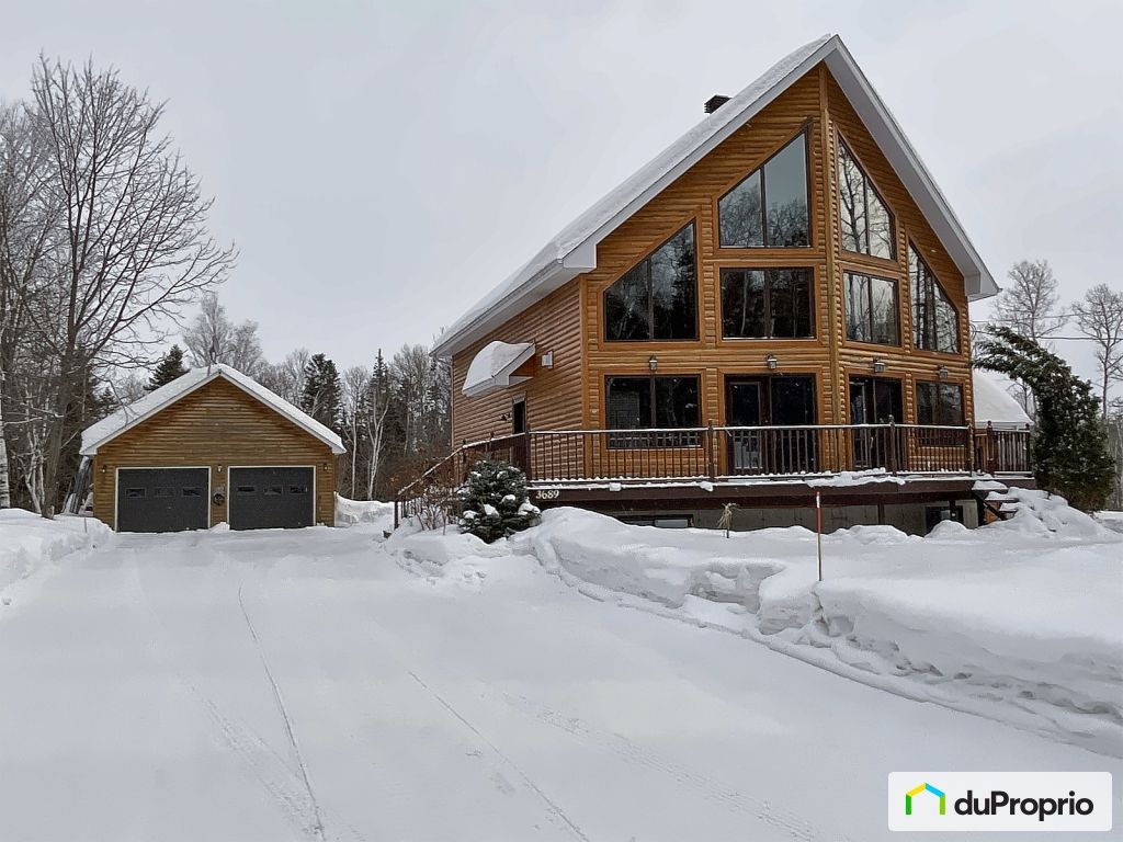 $695,000 - Bungalow for sale in Jonquière (Lac-Kénogami) — photo 1
