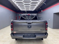 The 2022 Ram 1500 Sport 4x4 Crew Cab in a striking gray exterior is a vehicle crafted for those who... (image 4)