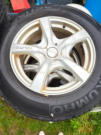 2012 Volvo aluminum rims and tires for sale! Kumho Sense size 225/65-17 with 80% thread left on them...