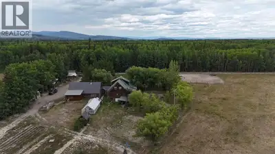 Stunning log home on 153 acres, with approx. 50 acres in hay production. This incredible property in...
