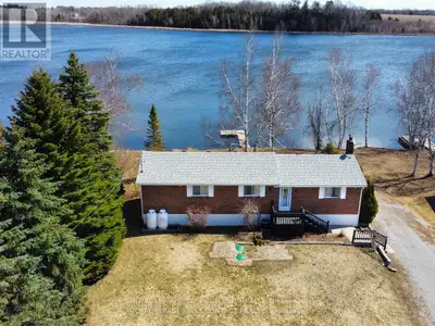Experience the ultimate lifestyle at this stunning, fully renovated waterfront bungalow/cottage on L...