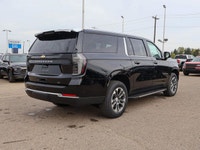 This Chevrolet Suburban boasts a Gas V8 5.3L/ engine powering this Automatic transmission. ENGINE, 5... (image 6)
