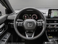 The 2025 Black Honda CR-V Hybrid Touring AWD is your gateway to balanced power and superior handling... (image 9)