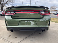 Introducing the dynamic 2023 Dodge Charger Scat Pack 392 Widebody in a striking green, complemented... (image 3)