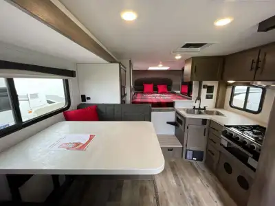 Adventurer Manufacturing Inc. Adventurer 89RBS truck camper highlights: Dream Dinette Slide Five Win...