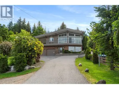 This exceptional property was built for breathtaking 180-degree lake with wharf and mountain views....