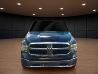 The 2022 Ram 1500 Classic SLT 4x4 Crew Cab in striking black is the perfect combination of power and... (image 2)