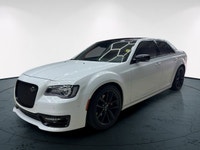 The 2023 Chrysler 300, particularly the 300C RWD in pristine white, is a powerful sedan that truly s... (image 1)
