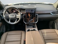 The spacious cabin offers premium refinement with perforated leather-appointed first-and second-row... (image 9)