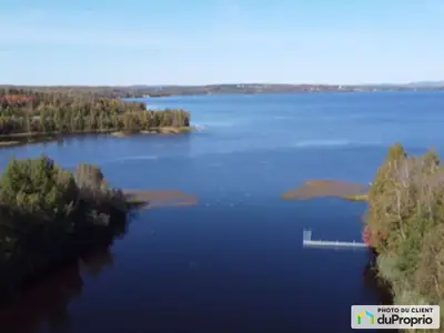 Terrain boisé sur le bord de l'eau donnant sur lac Aylmer. Prêt à construire. Incluant passerelle su...