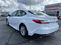 Experience effortless driving with this 2025 Toyota Camry SE, boasting a pristine white exterior and... (image 6)