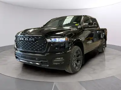 The 2026 Ram 1500 Big Horn, presented in a commanding Black finish and equipped with a robust 4x4 dr...