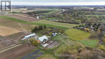 Discover an extraordinary 122.4 acre farm estate nestled along the Grand River, offering a rare blen...