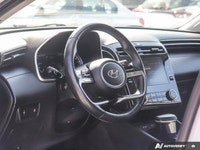 The 2023 Hyundai Tucson Preferred, featuring a brilliant Crystal White exterior complemented by a re... (image 8)