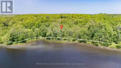A prime waterfront building lot on Large Lake Manitouwabing with a long view and stunning west expos...