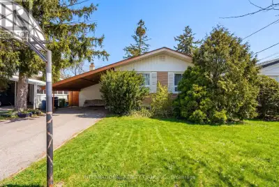 Bungalow on a rare ravine lot with mature trees, rolling hills, and exceptional privacy. Located on...